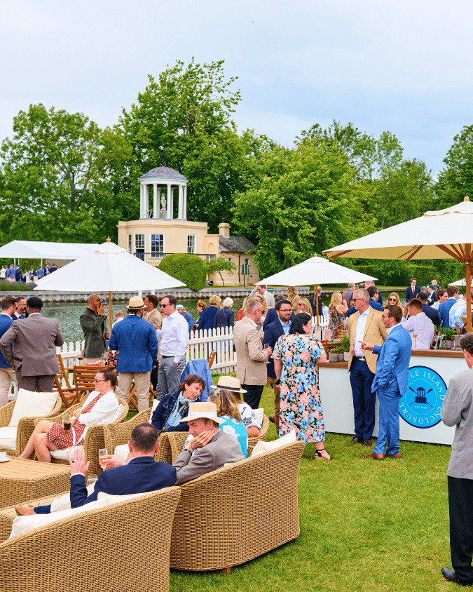 Hospitality guests milling around overlooking temple island and the Thame river